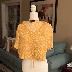 Yellow and white shirt sleeved blouse